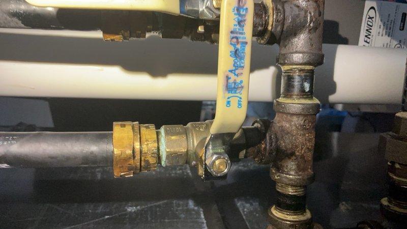 Responded to gas leak at fireplace gas line branch initially detected near furnace. Performed bubble test to isolate leak location, identifying failure at gas hose fitting connection to branch line. Attempted tightening of compression fitting, but upon removal discovered tear in hose at fitting interface. Removed defective gas hose, provided estimate for replacement, received customer approval, and successfully replaced damaged component. Verified integrity of new installation with leak test to ensure safe operation of gas system.
