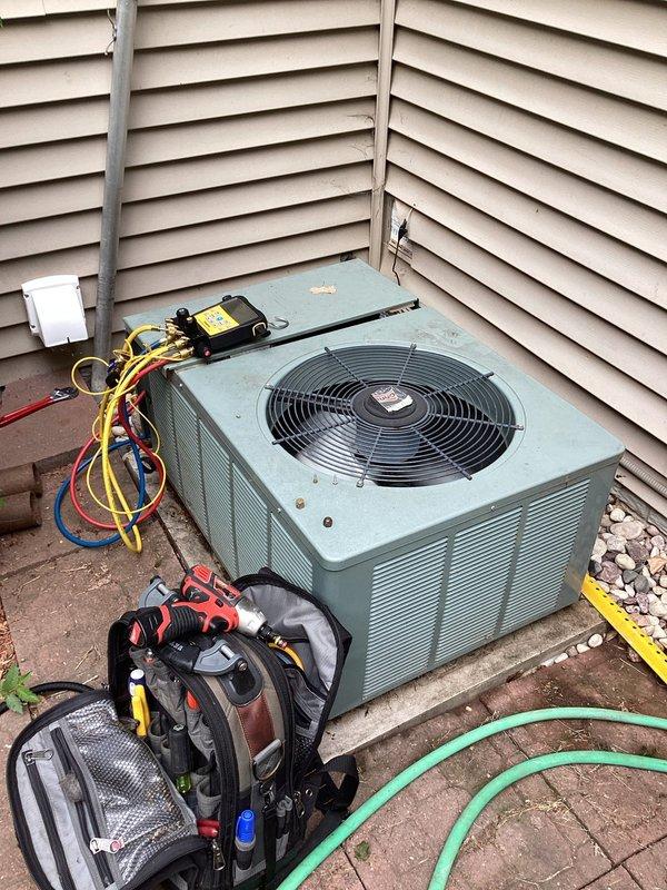 Responded to no cooling call on 15+ year old residential air conditioning system. Upon arrival, performed diagnostic evaluation and confirmed unit was low on refrigerant charge. Connected manifold gauges and service equipment to measure system pressures. System was operating with insufficient refrigerant levels, preventing adequate cooling capacity. Recharged system to proper specifications using appropriate refrigerant recovery and charging procedures. Due to age of equipment and current condition, provided estimate for complete system replacement as a long-term solution.