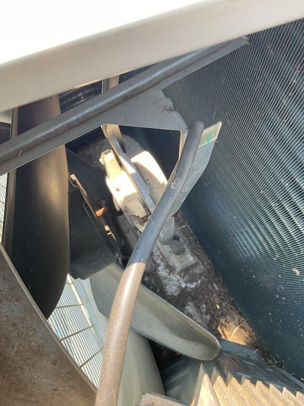 Responded to service call for upstairs Daikin mini-split system displaying "call service" error with flashing indicator light and no cooling. Upon inspection, diagnosed failed outdoor fan motor with inoperative outdoor unit. Inspected internal control board and heat sink assemblies, noting accumulated debris on evaporator coil fins. Determined replacement parts required: control board, outdoor fan motor, and fan blade. Submitted parts order for expedited delivery to restore system operation.