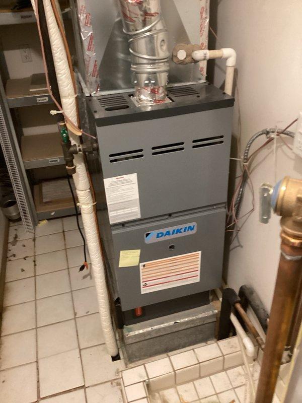 Completed annual spring tune-ups on three AC systems across multiple properties, including installation of customer-supplied furnace filters and verification that humidifiers were properly shut down for the cooling season. During inspection, discovered the middle condenser/furnace system in the larger mechanical room was significantly low on refrigerant charge, indicating an active leak; added 3 lbs of R410A refrigerant and injected leak detection dye to facilitate future leak location identification. All three systems are currently operating properly, with follow-up recommended once the system loses charge again to allow sufficient dye migration for effective leak detection and repair.