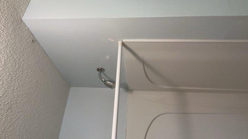 Responded to a water leak originating from an upstairs shower that was causing water intrusion to the lower level. Upon investigation, identified a faulty shower valve as the source of the leak. Relocated the bathroom vanity to access the shower valve assembly behind the wall, then removed and replaced the defective shower valve to eliminate the leak. Additionally, installed new toilet tank components per request to address separate fixture maintenance needs.