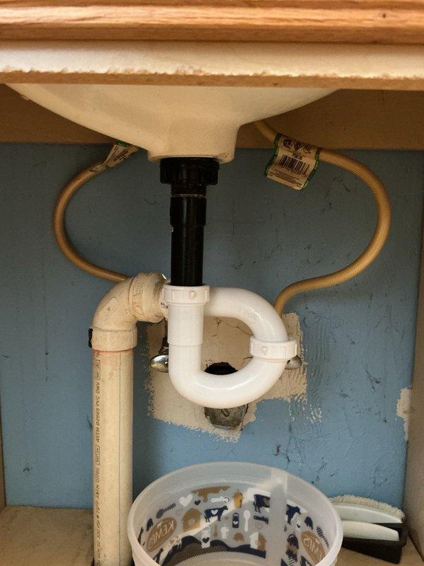 Responded to callback regarding two toilets installed the previous week that appeared unlevel due to uneven flooring conditions. Addressed customer concern and confirmed toilets were set properly given the floor conditions. Replaced cracked P-trap assembly under bathroom sink that was causing active leak. Installed new P-trap and verified all connections were secure with no leaks present upon completion.