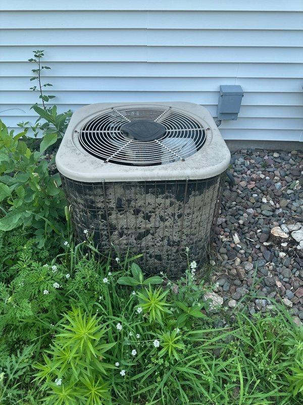Responded to no-cooling complaint on 28-year-old residential air conditioning system. Upon arrival, confirmed indoor blower operational but outdoor condenser unit fan not running. Diagnostic testing revealed failed dual-run capacitor preventing compressor and condenser fan operation. Additionally, system found to be low on R22 refrigerant, indicating potential leak in aged system. Replaced defective capacitor to restore immediate cooling function and recharged system with R22 refrigerant to proper operating levels. Due to advanced age of equipment, obsolete refrigerant type, and overall condition showing significant weathering and deterioration, scheduled follow-up consultation with comfort advisor to discuss system replacement options and long-term solutions.