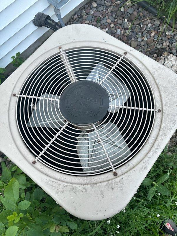Responded to no-cooling complaint on 28-year-old residential air conditioning system. Upon arrival, confirmed indoor blower operational but outdoor condenser unit fan not running. Diagnostic testing revealed failed dual-run capacitor preventing compressor and condenser fan operation. Additionally, system found to be low on R22 refrigerant, indicating potential leak in aged system. Replaced defective capacitor to restore immediate cooling function and recharged system with R22 refrigerant to proper operating levels. Due to advanced age of equipment, obsolete refrigerant type, and overall condition showing significant weathering and deterioration, scheduled follow-up consultation with comfort advisor to discuss system replacement options and long-term solutions.