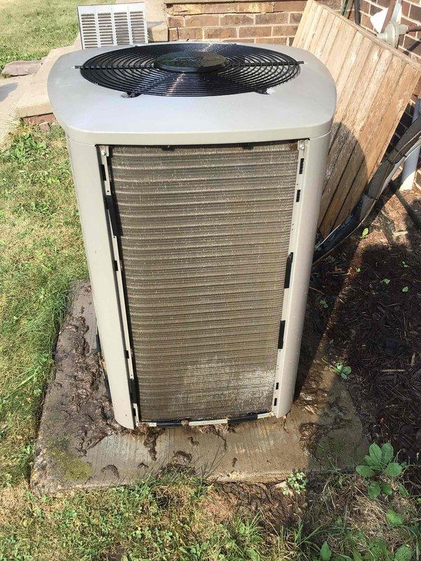 Responded to no cooling complaint with indoor temperature at 82 degrees. Found system in pressure switch lockout due to severely packed outdoor condenser coil restricting airflow. Thoroughly cleaned condenser coil, reset pressure switch, and verified proper system operation with normal cooling restored.
