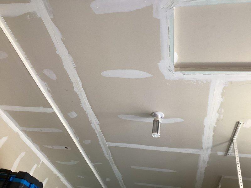 Responded to report of water leak originating from attic area. Upon arrival and thorough inspection of the attic space and affected ceiling areas, determined that the moisture intrusion was not related to the plumbing system. Inspected all visible plumbing lines, fixtures, and connections in the attic with no evidence of active leaks, water damage, or plumbing system failure. Documented findings with photographs showing ceiling conditions and confirmed issue appears to be roofing-related rather than plumbing-related, requiring follow-up with roofing specialist.