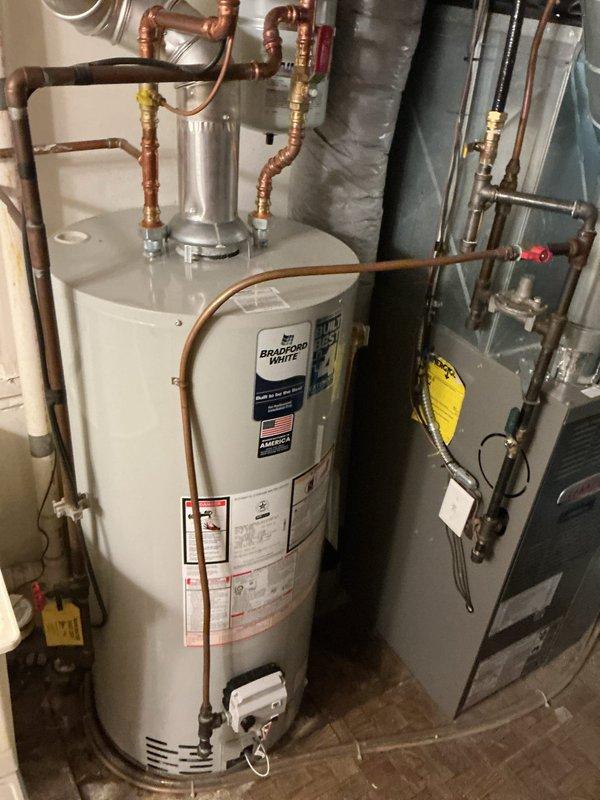 Responded to call back for no hot water on recently installed Bradford White water heater. Upon inspection, determined that the water heater pilot light had not been lit following previous work performed by another contractor who installed a new gas stove line. Successfully ignited the pilot light and verified proper operation of the water heater. Unit is now functioning correctly and providing hot water as designed.