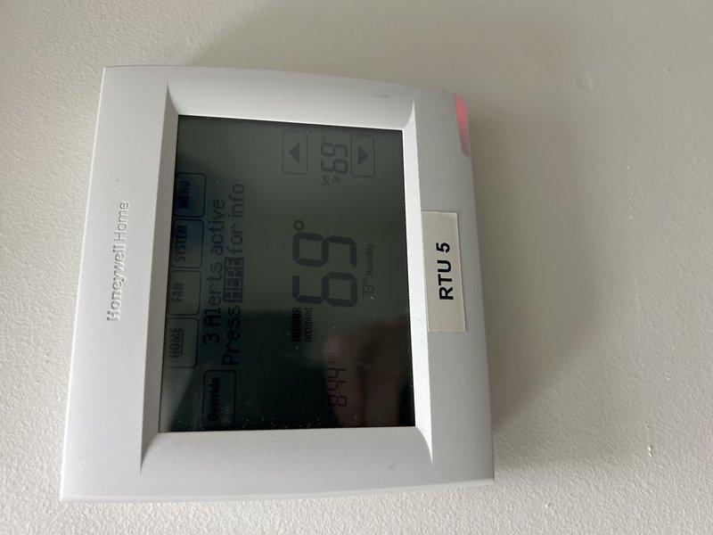 Completed battery replacement in remaining zone sensors for RTU 2 and RTU 5. Noted ongoing humidity discrepancy in Zone 2 where system sensors read approximately 60% while independent monitoring equipment indicates humidity levels consistently reaching 80-87% range. System currently operating in cooling mode with zone averaging sensors communicating properly post-battery replacement, though humidity control issue persists and may require further sensor calibration or equipment evaluation.