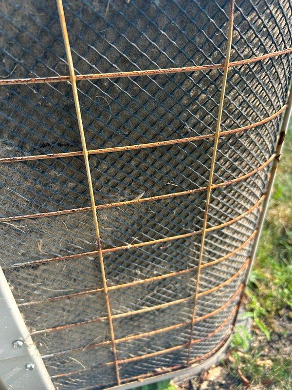Responded to no cooling call with reported power issues following utility outage. Upon arrival, found outdoor unit not receiving 240V power supply. Attempted to restore power by resetting breaker, which resulted in loud arcing and tripped main electrical panel for entire residence. Inspection revealed compressor had sustained electrical damage from previous arcing event reported by homeowner. Outdoor condenser coils found extremely dirty and clogged with debris, restricting airflow and contributing to system stress. Heavy rust and corrosion noted on protective grille and wire guard. Unit displayed signs of electrical shock damage to compressor components. Due to severity of electrical failure and compressor damage, system deemed unsafe to operate. Documented conditions with photographs showing deteriorated coil condition and overall unit neglect. Scheduled comfort advisor appointment for same day between 12-2pm to provide system replacement options and cost estimates for customer consi