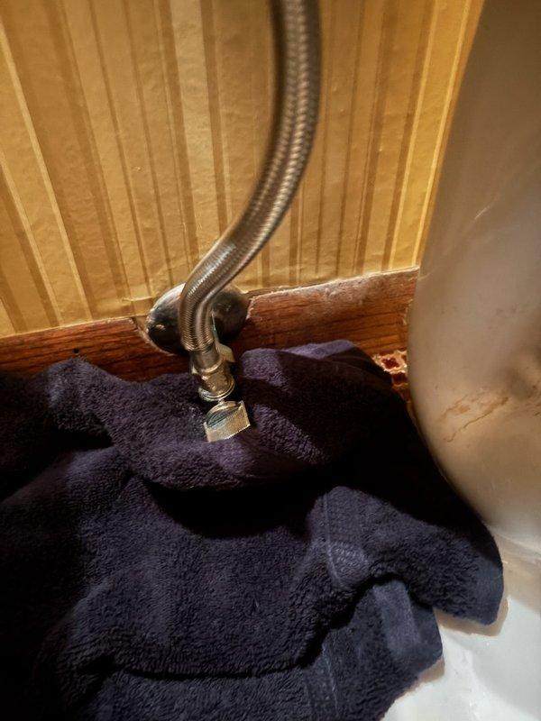Responded to a toilet leak that required shutting off water to the home. Upon inspection, discovered the fill valve was not properly secured and the angle stop valve was not fully closed, both contributing to the continuous leak. Removed the defective fill valve and installed a new replacement unit, ensuring proper installation and secure connections. Verified angle stop was functioning correctly and fully closed. Tested the system to confirm the leak was eliminated and water supply restored to the home.