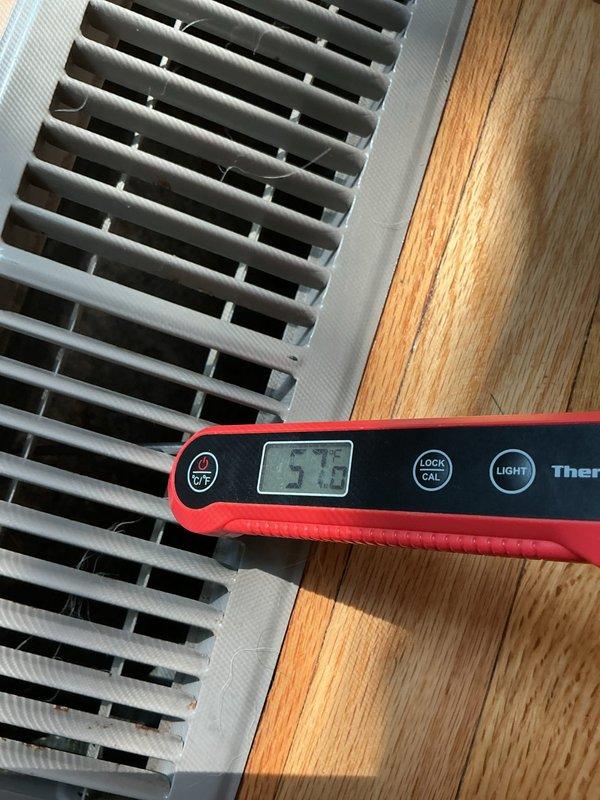 Responded to warranty no-cool call on recently installed system that was not maintaining temperature. Upon inspection, discovered incorrect dip switch configuration on the control board. Corrected settings by turning off dip switches 1 and 4, while activating dip switches 2 and 3 per manufacturer specifications. Verified proper system operation with supply air temperature measuring 57.2°F at register, confirming adequate cooling performance and resolving the issue.