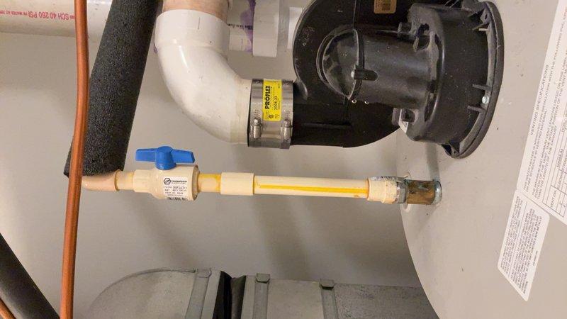 Conducted on-site evaluation for gas water heater replacement. Assessed existing tank-style water heater installation, including gas supply line with flexible yellow CSST connector, shut-off valve, and associated plumbing connections. Documented current system configuration with copper supply lines, PVC venting, and electrical components. Provided customer with comprehensive replacement options comparing traditional tank-style units versus tankless water heater systems, including necessary modifications to gas lines, venting requirements, and plumbing connections for each option.