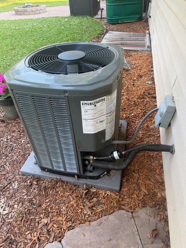 Responded to service call for reported loud noise from outdoor Trane air conditioner unit. Upon arrival, started system and allowed to run for several minutes, but no abnormal sound was present during operation. Performed comprehensive diagnostic inspection of 2022 R-410A condenser unit, verifying subcooling at 15 minutes runtime measured 9.5°F and 9.8°F, within acceptable 10°F target range. Thoroughly inspected outdoor electrical and mechanical components including contactor, capacitor, compressor, control wiring, and L1/L2 power wiring; found no shorts, damage, or conditions indicating noise source. Proceeded to inspect indoor Goodman two-stage furnace from 2011. Verified blower wheel was clean and free of debris, inspected evaporator drain line with no issues found, and confirmed proper system performance with 19°F supply/return temperature split. System is currently cooling properly and operating within normal parameters. Unable to reproduce reported noise condition during service 