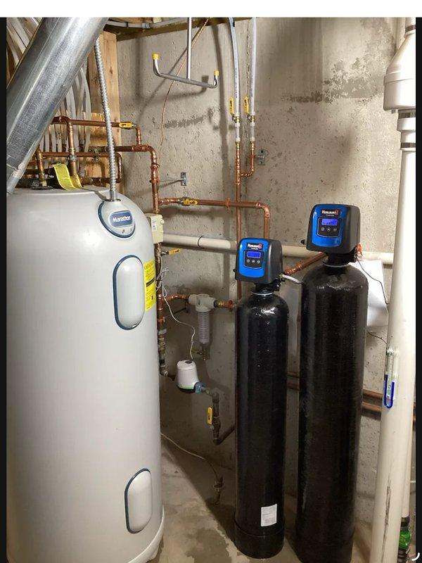 Responded to no-power issue affecting water softener system installed last November. Found tripped GFI outlet causing complete power loss to water treatment units and radon mitigation fan. Reset GFI receptacle, restoring power to all equipment. Verified operational status of dual-tank water treatment system with digital control heads. Adjusted system parameters by reducing backwash cycle duration on carbon filtration tower and extending regeneration intervals to optimize performance and efficiency.