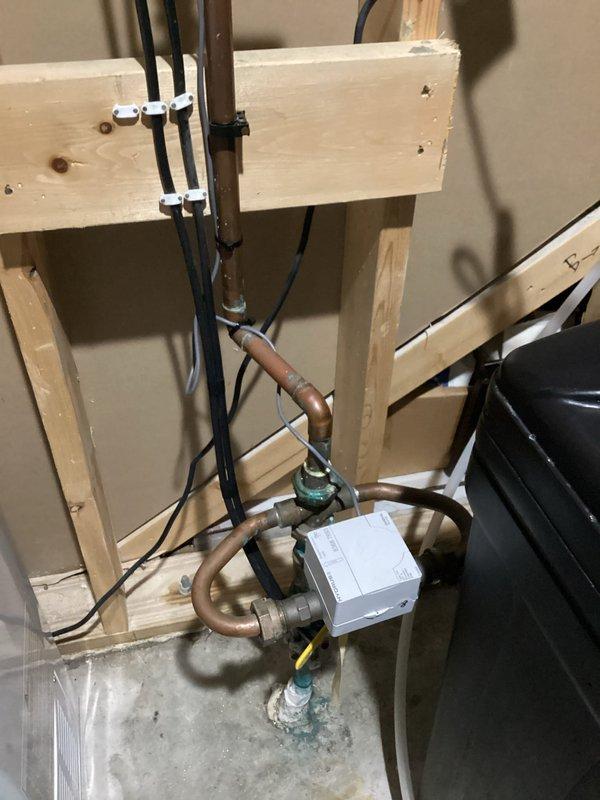 Responded to water leak at main supply line where elbow fitting above the water meter showed active leaking. Removed and replaced the defective elbow section and associated pipe segment with new copper components. Verified all connections were secure and tested system under full pressure to confirm leak was eliminated and proper water flow was restored.