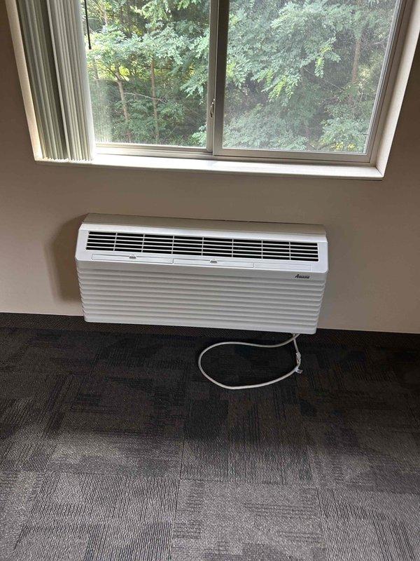 Responded to service call for WiFi thermostat configuration and connection to newly installed wall-mounted PTAC unit. Installed thermostat on wall, established WiFi connectivity between stat and unit, and performed operational testing to verify proper communication and function of the climate control system.
