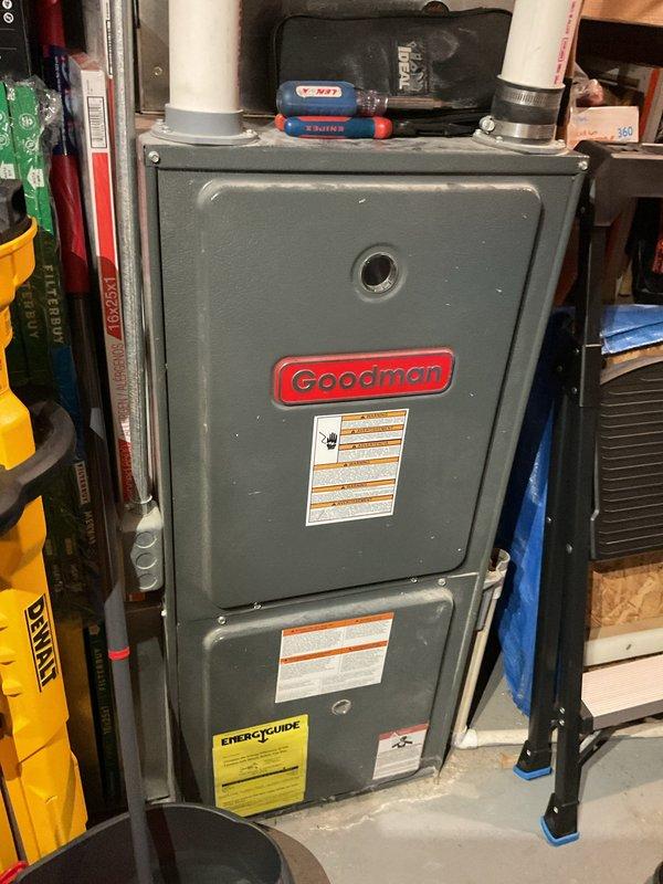 Performed comprehensive air conditioning tune-up on 20-year-old Goodman system. Verified system operation with temperature differential measuring 18-19°F across the evaporator coil. Tested capacitor functionality and confirmed proper operation. Recorded suction pressure at 75 PSI under 90°F ambient conditions, indicating adequate refrigerant charge. Thoroughly cleaned condenser coil which had accumulated significant debris affecting heat transfer efficiency. Recommended pre-season furnace inspection due to age of equipment before heating season begins.