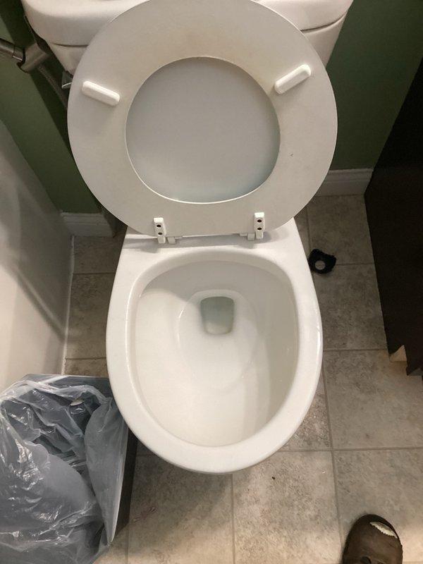 Responded to clogged toilet caused by foreign object lodged in trapway. Upon inspection, determined that a baby wipe container lid had been accidentally flushed, creating complete blockage. Successfully cleared obstruction using toilet auger, restoring full drainage and proper flush function. Verified toilet operation with multiple test flushes to ensure complete removal of blockage and normal water flow.