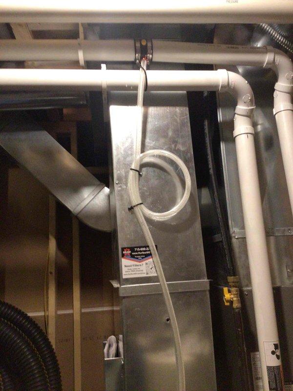 Returned to address condensation leak issue on high-efficiency HVAC system installed less than one year ago. Installed condensate drain kit to resolve water leakage problem. Verified proper drainage by leaving pipe end open during testing to confirm no water bypassed the kit. All condensate lines now draining properly with no leaks detected.