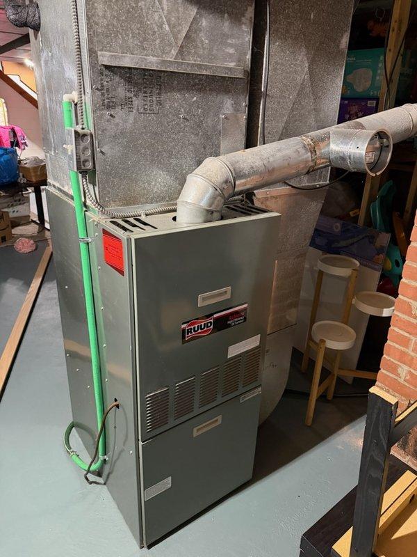Performed comprehensive A/C and furnace tune-up on residential Ruud HVAC system. Cleaned outdoor condenser unit, tested all electrical and mechanical components for proper operation, and cleared condensate drain line. Ran system through full cooling cycle, verified equipment operating within normal parameters with adequate cooling output and proper condensate drainage. No issues identified at time of service.