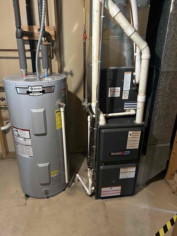 Responded to no cooling complaint on 8-year-old residential air conditioning system. Upon inspection, found outdoor condensing unit with ice formation and low refrigerant charge. Advised customer to turn system off immediately to prevent compressor damage. Documented equipment condition with photos of outdoor condenser unit and indoor furnace/air handler installation. Contacted point of contact on file and provided estimate via email for refrigerant leak diagnosis and system recharge.