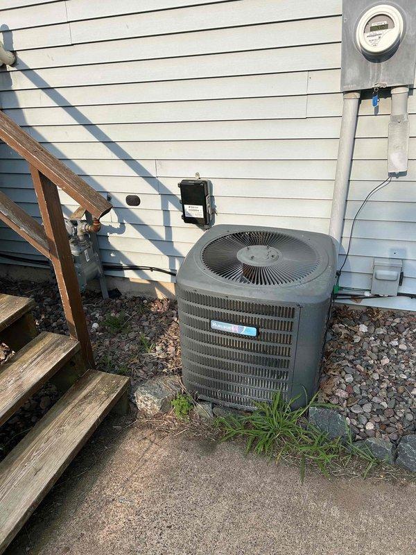 Responded to no cooling complaint on 8-year-old residential air conditioning system. Upon inspection, found outdoor condensing unit with ice formation and low refrigerant charge. Advised customer to turn system off immediately to prevent compressor damage. Documented equipment condition with photos of outdoor condenser unit and indoor furnace/air handler installation. Contacted point of contact on file and provided estimate via email for refrigerant leak diagnosis and system recharge.