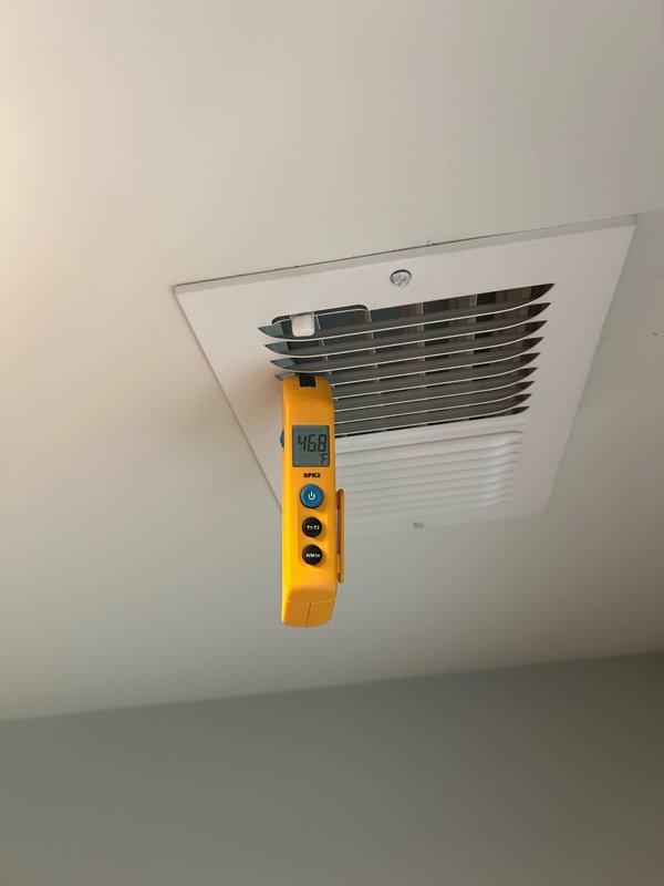 Responded to no cooling complaint on attic-mounted mini split unit. Found condensate drain line and tube completely plugged, causing flood switch to trip and shut down system. Cleared blockage using vacuum from both interior and exterior access points, removed standing condensation water, and reset flood switch. Verified proper drainage operation and confirmed unit returned to normal cooling function. Inspected filters and found them in acceptable condition with replacement recommended for late August. Measured supply air temperature at 46.8°F, confirming adequate cooling performance post-repair.