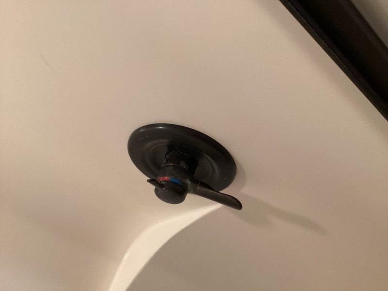 Completed installation of customer-supplied Delta kitchen faucet to replace old unit that was difficult to shut off. Additionally installed new shower head and handle assembly in owner's suite bathroom using parts provided by homeowner. All fixtures tested for proper operation and leak-free connections upon completion.
