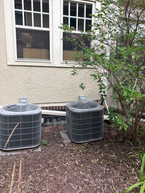 Responded to no cool complaint on residential property with two 16+ year old Carrier AC systems struggling to maintain temperature during hot weather. Performed diagnostic evaluation on both attic and basement units.

**Attic Unit Findings:**
Identified low refrigerant charge causing reduced cooling capacity. Observed partial evaporator coil freeze-up due to insufficient refrigerant levels. System operating outside normal parameters. Discussed repair options with homeowner and scheduled service advisor visit for comprehensive evaluation and refrigerant leak detection/repair recommendations.

**Basement Unit Findings:**
Tested capacitor and found weakened performance approaching failure threshold. All other components including compressor, blower motor, and controls operating within specifications. Verified refrigerant charge at proper levels. Measured supply and return air temperatures confirming 20-degree temperature split, within acceptable range for proper system operation.

**Servi