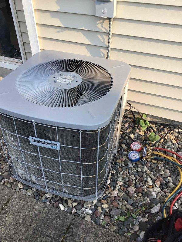 Responded to no-cool complaint on 10-year-old R22 system experiencing icing at outdoor unit and inability to maintain temperature below 80°F. Connected manifold gauges to condenser unit and performed pressure diagnostics, confirming system was low on refrigerant charge. Provided repair estimates to address refrigerant leak and recharge system, but customer elected to proceed with full system replacement instead of repair.