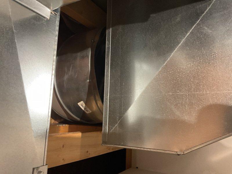 Performed cooling maintenance on a 2019 Nordyne split AC system with furnace serving a 5,000 sq ft home. Found the outdoor condenser coil heavily impacted with debris, restricting heat rejection and contributing to hot liquid line temperatures and elevated electric usage. Cleaned condenser coil to restore proper heat transfer efficiency. Indoor inspection revealed a 100,000 BTU furnace with PSC blower motor and undersized 16x25x1 filter arrangement for home size, which may be contributing to airflow restriction and increased operating costs. Observed water beneath blower housing and performed camera inspection of evaporator coil and drain pan. Removed delta plate and flushed approximately 1 gallon of water through condensate pan; primary drain system passed water successfully. Further investigation identified moisture source as condensation and water intrusion from PVC combustion air intake pipe, which was dripping onto gas valve, inducer assembly, and burner deck before migrating to b