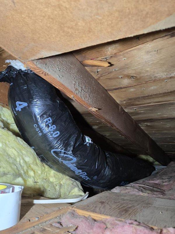 Installed new ductwork for bathroom exhaust fan on second level of residence. Accessed attic space adjacent to bathroom location and routed rigid ducting from newly installed bath fan to exterior vent termination. Work completed in accordance with permit requirements and building code specifications.
