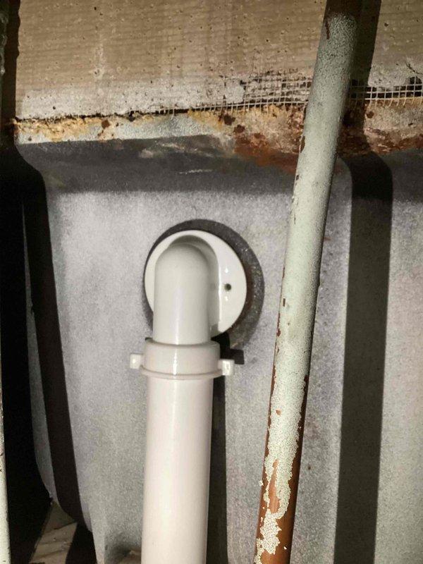 Responded to water leak complaint at rental property where bathtub was leaking during use. Upon inspection, discovered missing gasket on the overflow assembly. Accessed plumbing from below through basement/utility area, confirmed leak source at tub overflow connection, and installed replacement gasket to restore proper seal and eliminate water infiltration.