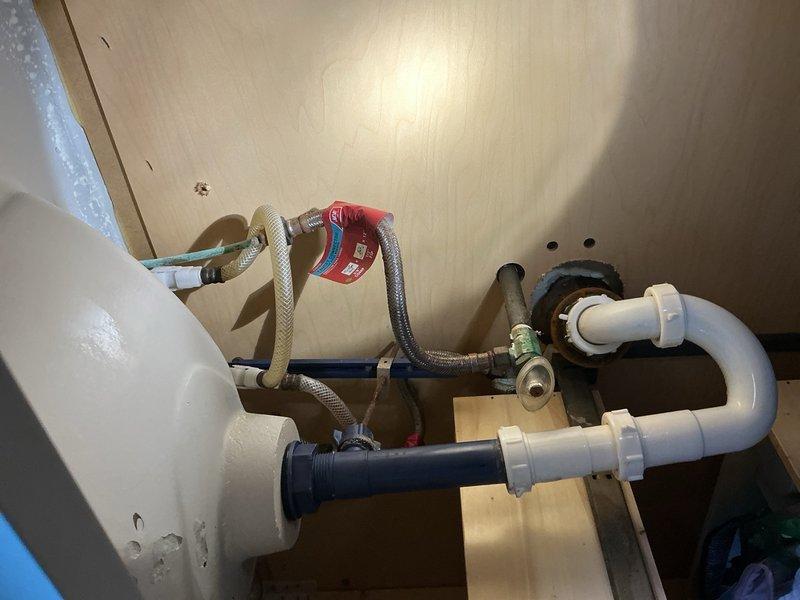 Responded to service call for leak under kitchen sink. Upon inspection, identified internal leak in faucet assembly causing water damage beneath the basin. Diagnosed faulty faucet cartridge unable to maintain proper seal, resulting in continuous dripping and water accumulation in cabinet space. Provided estimate for complete faucet replacement as most cost-effective solution given extent of internal component failure. Documented existing plumbing configuration including supply line connections and shut-off valve locations for future service reference.