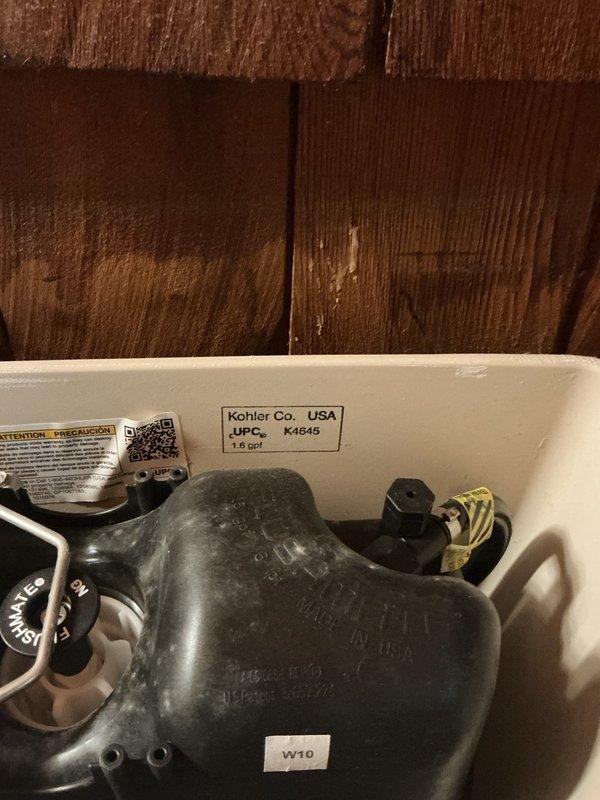 Responded to service call for non-functioning toilet with active leak. Upon inspection, performed power flush to assess system operation and identified deteriorated tank-to-bowl gasket as the source of water leakage. Removed tank lid to examine internal components, including Kohler flush valve assembly and connecting hardware. Documented existing conditions and verified model specifications (1.6 GPF) for proper parts ordering. Completed part order form for replacement tank-to-bowl gasket with manufacturer specifications to ensure correct fit upon return visit for installation and final repair.