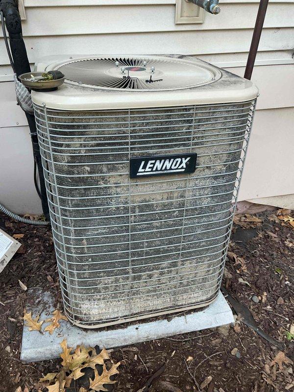 Responded to no cool call on 25-year-old Lennox R22 central air conditioning system. Upon arrival, found unit briefly starting then tripping breaker after approximately 5 seconds of operation. Measured locked rotor amperage at 244 amps against rated capacity of 137 amps, indicating compressor failure. During inspection, discovered exposed low voltage wiring to contactor causing intermittent chattering, which likely contributed to compressor failure through rapid short cycling. Due to R22 refrigerant system and age of equipment, compressor replacement not viable option. Coordinated with service advisor for system replacement consultation.