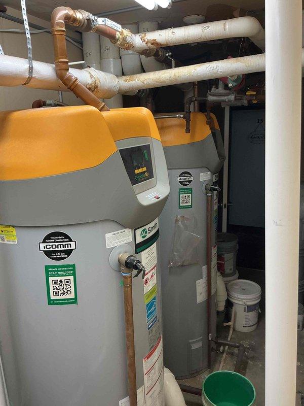 Responded to no cooling complaint on PTAC unit. Upon arrival, activated unit and observed blower motor operating normally, but compressor exhibited bucking behavior and failed to start. Deactivated system and performed diagnostic testing on electrical components. Testing indicated compressor was grounded out, rendering it inoperable. Advised property owner that due to age and condition of unit, full PTAC replacement would be most cost-effective solution rather than compressor replacement. Owner declined replacement service and indicated intent to source and install unit independently. During visit, owner mentioned additional plumbing concerns in mechanical room area, including issues with water heating equipment and overhead piping. Documented plumbing needs and submitted follow-up request for coordinated service visit with plumbing technician to address water system concerns. Photographed mechanical room showing water heater with visible labeling, hot and cold water distribution lines
