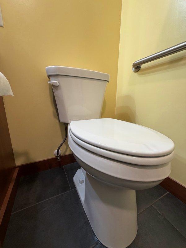 Installed new ADA comfort height toilet with wax ring, mounting bolts, and braided stainless steel supply line. Completed full installation including securing unit to floor flange, connecting water supply to wall-mounted shut-off valve, and verifying proper operation and seal integrity.