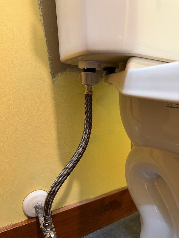 Installed new ADA comfort height toilet with wax ring, mounting bolts, and braided stainless steel supply line. Completed full installation including securing unit to floor flange, connecting water supply to wall-mounted shut-off valve, and verifying proper operation and seal integrity.