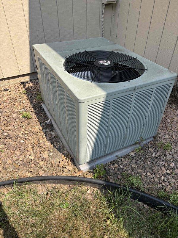 Performed comprehensive maintenance on one A/C system with 410A refrigerant under 83-degree ambient conditions. Inspected indoor air handler including filter, drain pan, blower motor, electrical wiring, and components with all items found in acceptable condition. Verified proper temperature split across evaporator coil. Inspected outdoor condensing unit including coil cleanliness and capacitor condition. Measured amp draw on blower motor, compressor, and contactor with all readings within manufacturer specifications. Verified refrigerant charge at proper levels. Identified aging capacitors (15mfd and 45+5mfd) showing signs of wear and provided replacement estimates for future consideration. System operating normally at completion of maintenance agreement service.