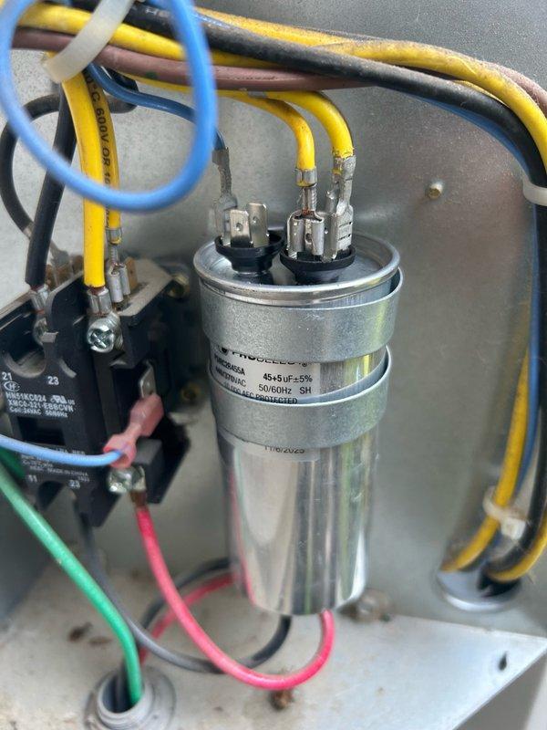Responded to no cooling complaint on 5-year-old central air conditioning system. Performed comprehensive diagnostic including air filter inspection, thermostat verification, blower speed check, and outdoor unit examination. Identified failed dual-run capacitor (45+5 MFD) as root cause of system failure. Replaced defective capacitor with new unit, verified proper electrical connections, and confirmed refrigerant system pressures within normal operating range. System restored to full cooling operation.