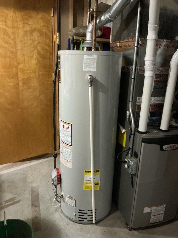 Responded to service call for non-operational water heater with reported unusual odor. Upon inspection, identified small gas leak at gas tank fittings caused by repeated opening and closing of access door. Removed old gas tank and deteriorated fittings. Installed new gas tank with proper sealing and installed new shut-off valve to ensure safe operation and code compliance. Tested all connections for leaks and verified proper water heater function upon completion.
