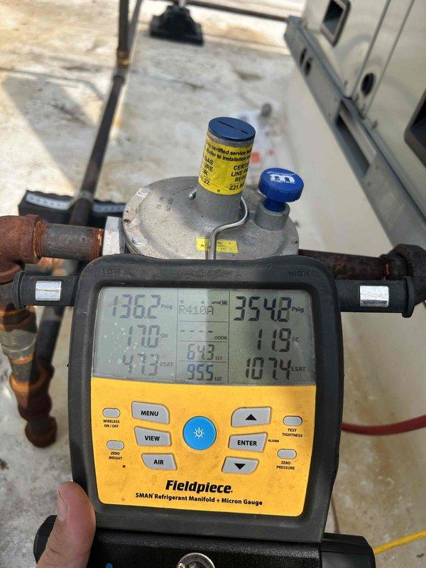 Performed diagnostic follow-up on HVAC system after multiple previous visits. Conducted pressure test on liquid and suction lines to verify proper refrigerant charge levels, recording gauge readings of 1362 PSI and 3548 PSI along with temperature measurements of 76.8°F. Ran and tested equipment, documented all findings with photographs for service records.