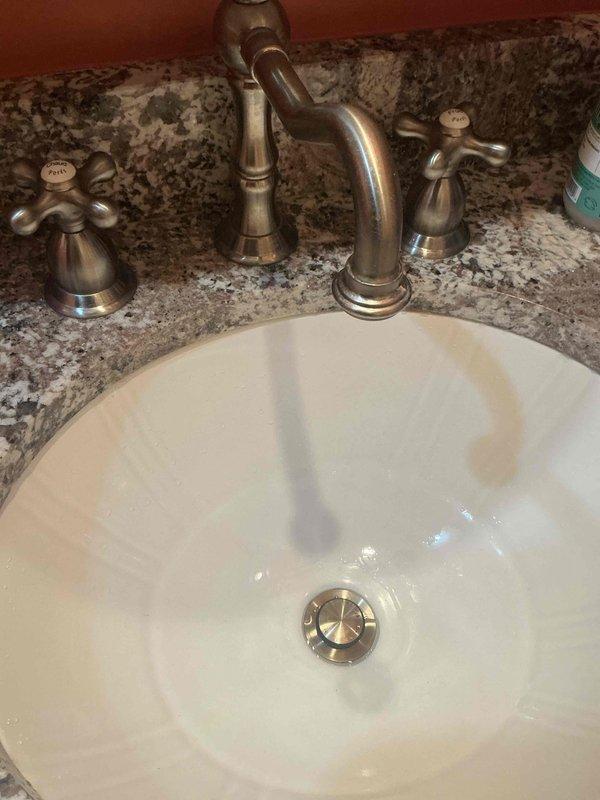 Responded to callback for drain assembly installed previous day that would not hold water in sink basin. Upon inspection, identified faulty pop-up gasket as source of leak. Ordered replacement part for proper repair and water retention.