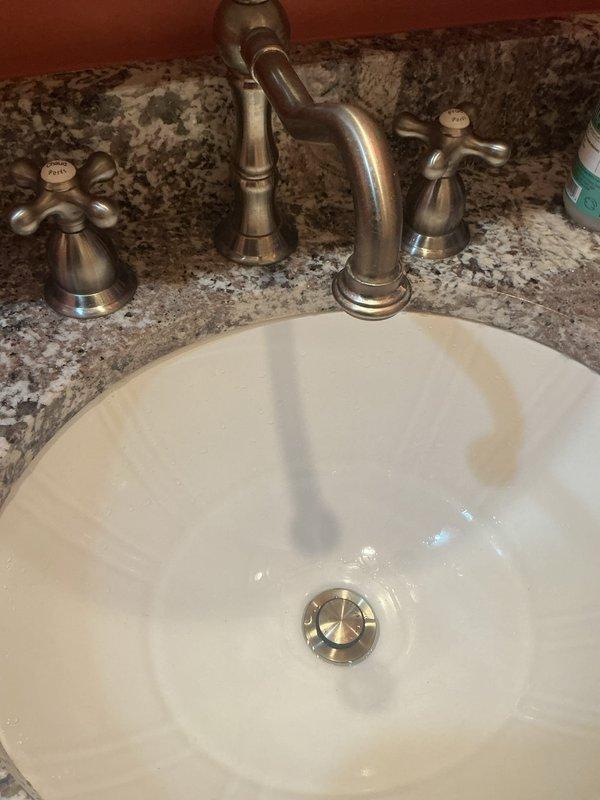 Responded to callback for drain assembly installed previous day that would not hold water in sink basin. Upon inspection, identified faulty pop-up gasket as source of leak. Ordered replacement part for proper repair and water retention.