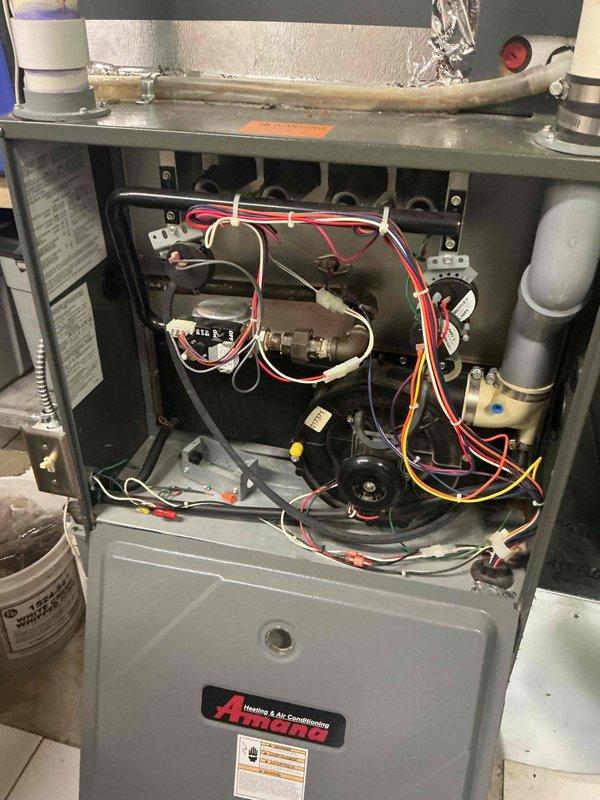 Responded to a no cooling call on a 19-year-old Amana air conditioning system with outdoor unit not activating. Diagnosed and identified a failed capacitor as the root cause preventing compressor operation. Replaced the defective capacitor, restoring full system functionality. Verified contactor operation and confirmed refrigerant charge within acceptable parameters. Measured temperature split across evaporator coil, noting slightly lower than optimal differential due to high indoor load conditions combined with fixed orifice metering device. Inspected air filter and noted excessive restriction requiring replacement to improve airflow and system performance. All electrical connections tested and secured. System operational upon departure.