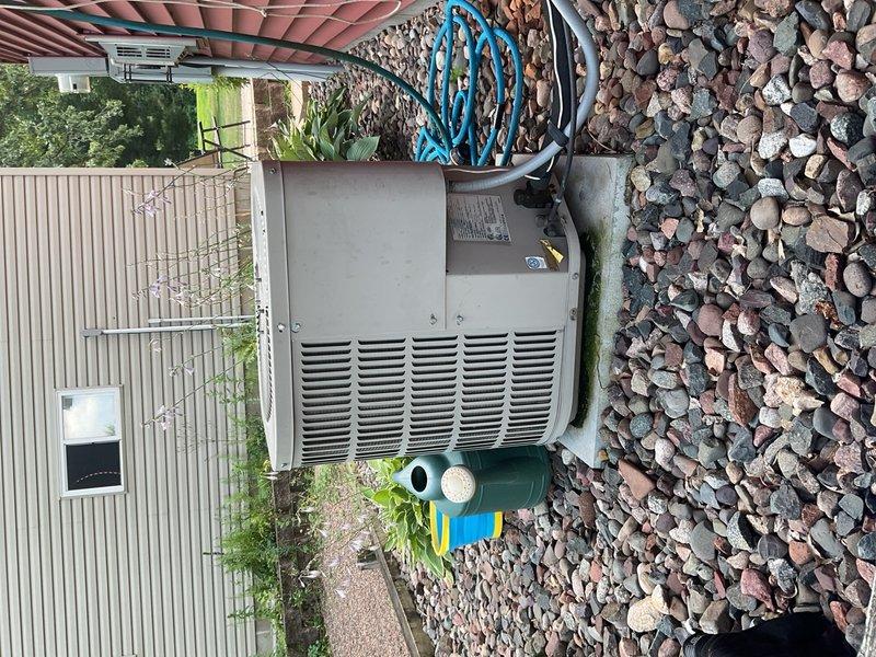 Performed routine maintenance inspection on a 2002 Goodman air conditioning system operating with R-22 refrigerant under 88°F outdoor ambient conditions. System operational but producing only 13°F temperature split, indicating diminished cooling capacity. New filter installed; however, airflow remains restricted, contributing to reduced system performance and comfort levels. Electrical connections and components inspected and found intact. Due to equipment age of 23 years, declining performance metrics, and inefficient operation with obsolete refrigerant, no adjustments available to significantly improve current cooling output. Advised homeowner that system is struggling to maintain desired setpoint temperatures and consuming excessive energy due to age-related degradation. Recommended planning for system replacement to restore adequate cooling capacity and energy efficiency.