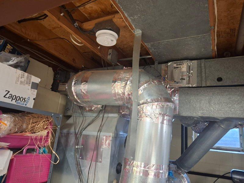Responded to no cooling complaint on 15-year-old Trane zoned HVAC system. Diagnosed malfunctioning zone motor for living room that was receiving proper signal from control board but failing to activate, preventing zone damper operation and resulting in inadequate cooling distribution throughout the home. Replaced defective zone motor and verified proper damper operation and system functionality upon completion.