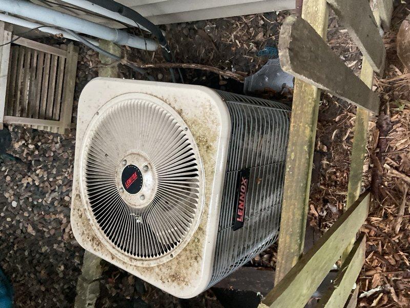 Responded to no cooling complaint on 1997 Lennox R-22 air conditioning system matched with older 80% gas furnace. Upon arrival, found system running but not cooling effectively. Performed diagnostic testing and identified failed dual run capacitor rated 35/5 µF reading 0/0 µF on both terminals. Tested compressor windings which showed open line to ground, confirming no ground short present at time of inspection. Replaced failed dual run capacitor to restore system operation.

Following repair, verified system performance with temperature measurements showing 77°F return air and 58°F supply air, producing acceptable 19°F temperature split across evaporator coil. System restored to operational status with adequate cooling capacity at time of departure.

Advised homeowner that due to system age (26 years old), obsolete R-22 refrigerant phase-out, and overall equipment condition, this repair should be considered temporary. Noted exterior disconnect panel showing significant rust and corrosi