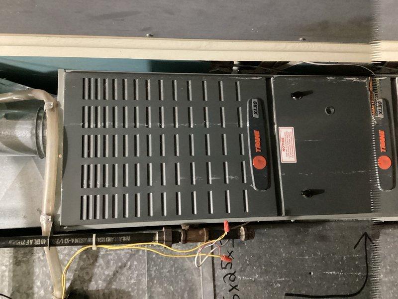 Completed comprehensive air conditioning tune-up and maintenance on a 20-year-old system experiencing reduced efficiency during peak cooling demand. Performed thorough inspection of evaporator coil, blower assembly, and air filter; cleared condensate drain line and tested float safety switch for proper operation. Inspected rooftop unit including condenser, condenser coil, contactor, compressor, and associated electrical components; verified refrigerant charge levels within manufacturer specifications. System restored to normal operation with all components functioning properly.